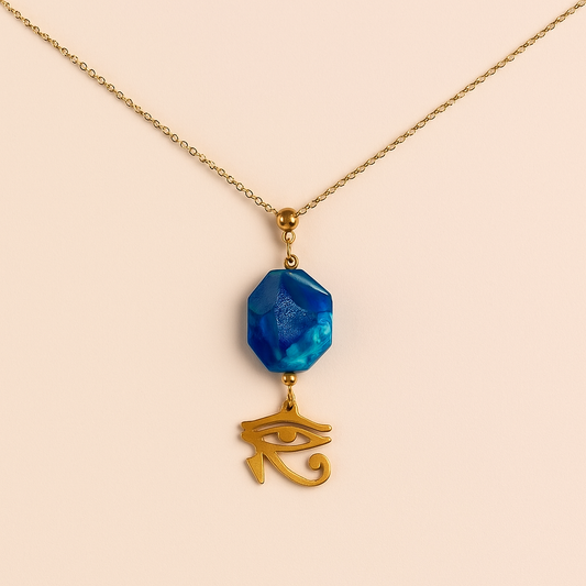 Blue agate gemstone pendant with gold Eye of Horus charm on a delicate gold chain – Horus & Agate Pendant by THE AURA CO.
