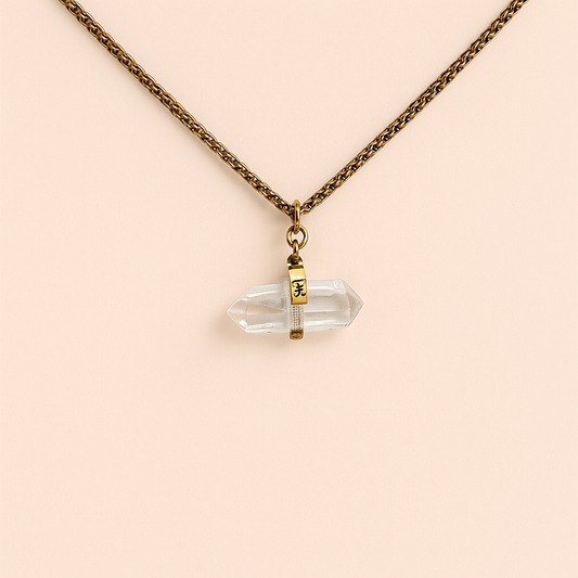 Double-terminated clear quartz crystal point pendant with gold engraved band on a gold rope chain – The Healing Choke by THE AURA CO.