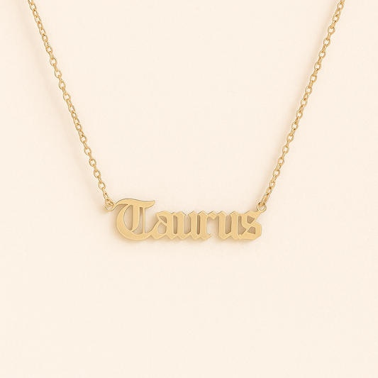 Gold old English font Taurus zodiac name necklace on a delicate gold chain – Zodiac Font Necklace by THE AURA CO.