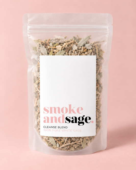 SMOKE & SAGE CLEANSE BLEND white sage leaves in a clear resealable pouch against a blush-pink background.